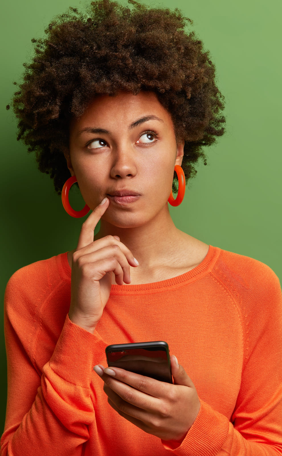 A woman thinking deeply about the answer to a question