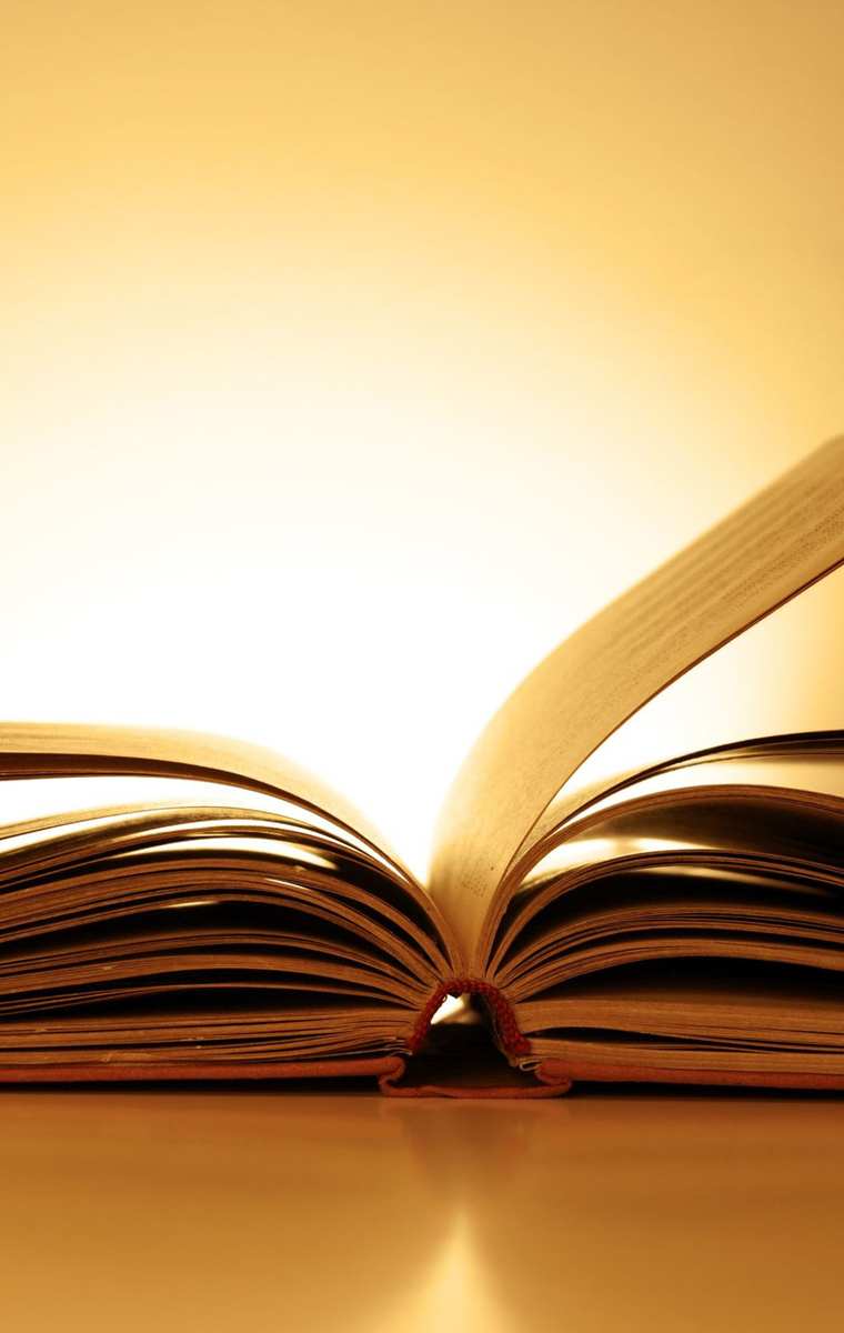 Open book against a luminous background