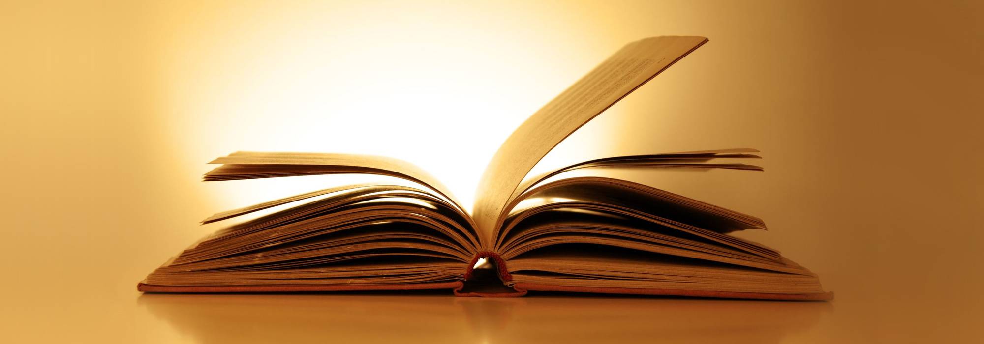 Open book against a luminous background